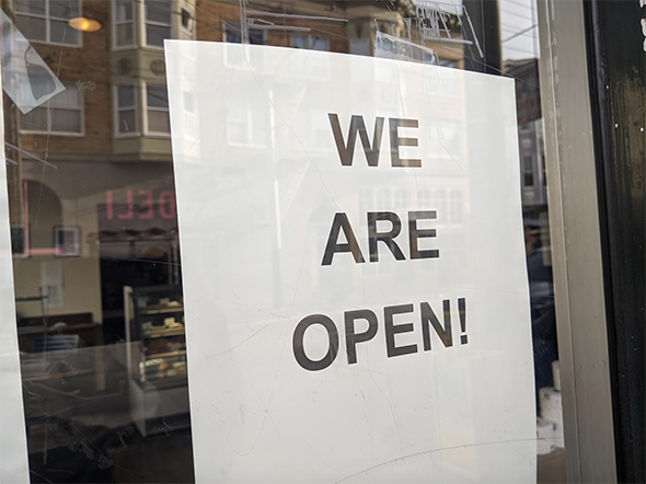 sign lets people know that the store is open